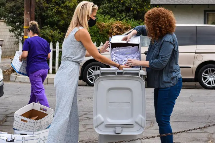 clients putting documents in an ADS shred container