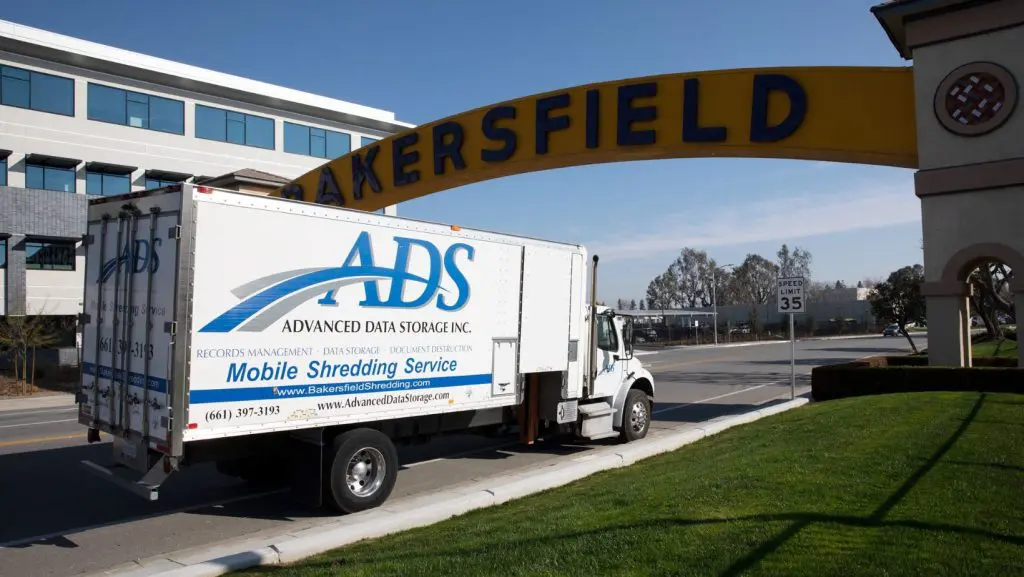 ADS truck going under Bakersfield sign